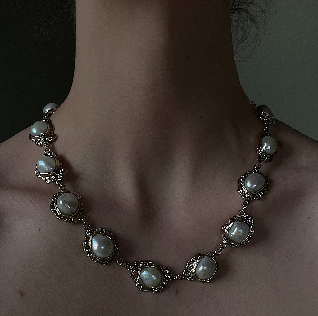 Family feud necklace brass.