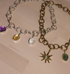 SMALL PEARL VIEW CHARM BRASS.