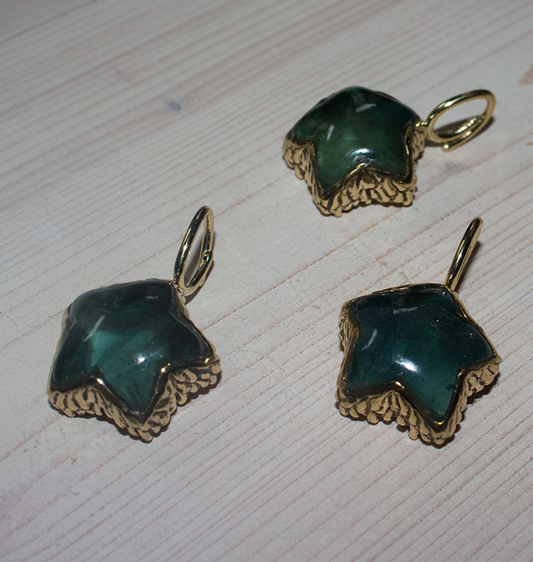 URSA CHARM BRASS FLOURITE.