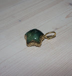 URSA CHARM BRASS FLOURITE.